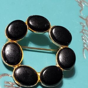 Elegant Black and Gold Brooch